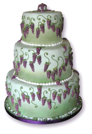 Green and purple wedding cake with grapes
