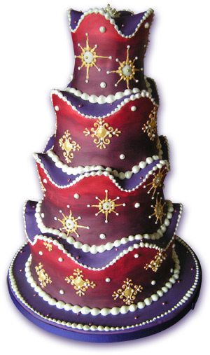 Red and purple wedding cake with gold and pearl mediaeval decorations