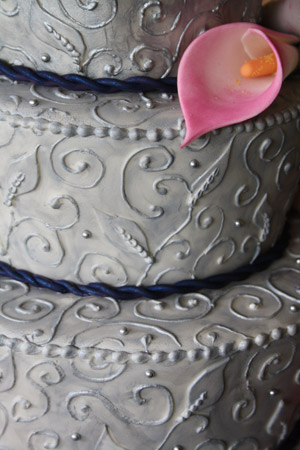 silver brocade wedding cake with calla lilies